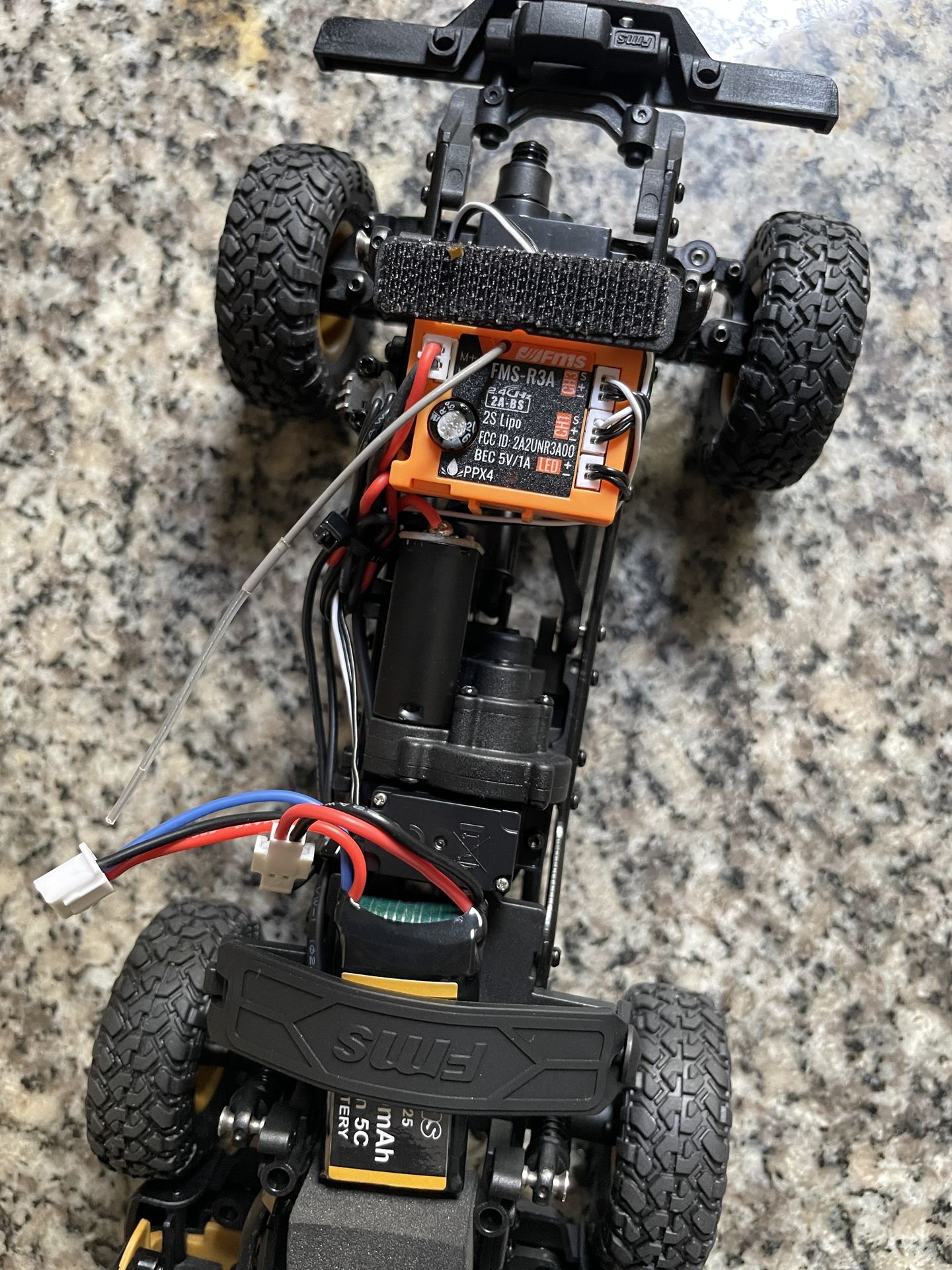 Stock FMS FCX24M chassis with jerky brushed motor and ESC